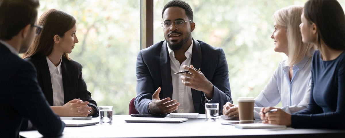 Trainer delivering sales workshop to UK business team