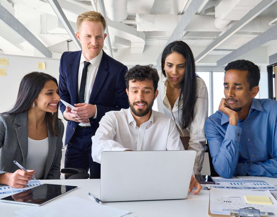 Sales team discussing a structured sales training approach during a meeting.