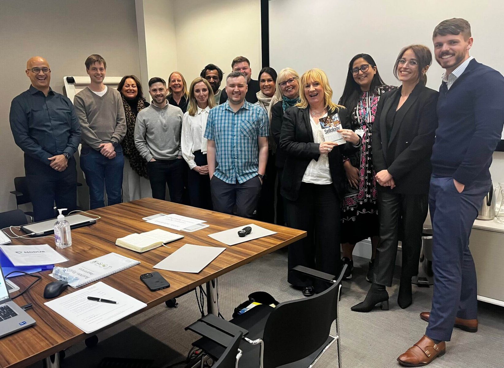 Sales team taking part in supportive training focused on confidence and wellbeing.